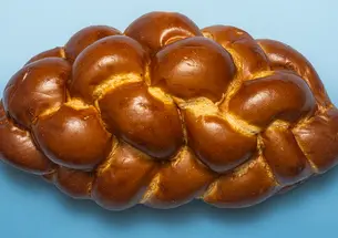 Challa bread on blue background