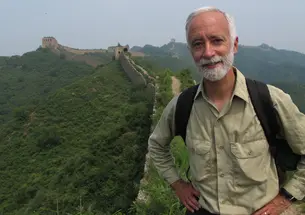 Robert McCracken Peck &rsquo;74 standing along the Great Wall of China