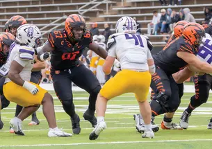 Tare Porbeni &rsquo;27, No. 67, began playing football as a high school junior. Now he&rsquo;s a pro prospect.