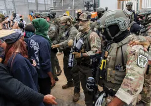 protesters and ice officers face off in newark, New Jersey, in June.