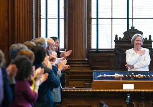 President Tilghman receives a final an ovation from the faculty April 29.