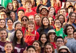 Group of students in colorful residential college t-shirts
