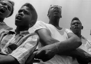 Freedom School, Mileston. Mississippi Summer Project, 1964: Summer volunteers, SNCC workers and local students singing freedom songs at Mileston, a community of independent black farmers in the Mississippi Delta near Lexington.