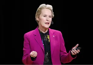 This is a photo of Frances Arnold ’79 speaking at a podium.