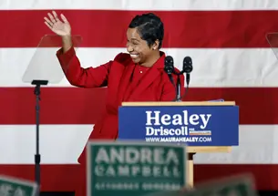 Massachusetts Attorney General-elect Andrea Campbell ’04 waves on stage during a Nov. 8 Democratic election night party. 