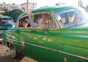 Frederick Hilles ’60, in the front seat, and in the back his wife, Jane Osgood, and Lee Fuller ’60 in Cuba last October. 