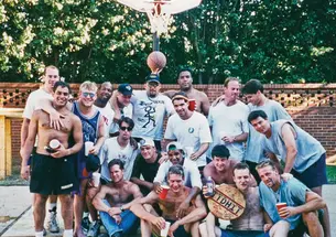 In 1997, when this photo was taken, a group of alumni founded a nonprofit that organizes sports programs for ­middle-schoolers. In the front row sitting, from left: Joel Sharp ’91, John Richard, Justin Long ’91, Thomas Bevan ’91; second row sitting