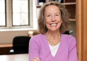 Anne Case, photographed in front of an empty office.