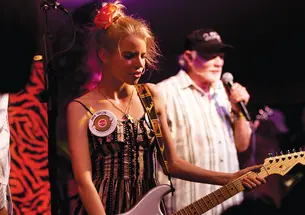 Anya Taylor-Joy with guitar