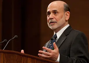Ben Bernanke speaks at a podium.