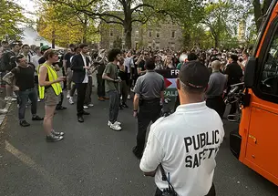 Protesters around the bus in front of Clio Hall.