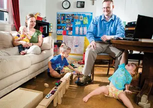 Dan Johnson GS; his wife, Julie; and their children Anders (5), Lucia (2), and Henrik (5 months) make good use of their small living room.