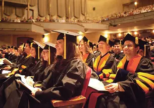 Advanced-degree recipients listen to George Will *68