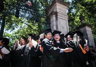 Mission accomplished: Graduates celebrate after the ceremony.