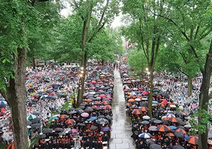 The front campus was filled with umbrellas and ponchos in this view of Commencement from Nassau Hall.