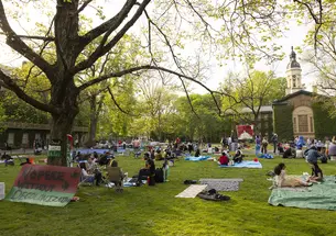 Pro-Palestinian protesters at their encampment on Cannon Green.