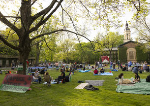 Pro-Palestinian protesters at their encampment on Cannon Green.