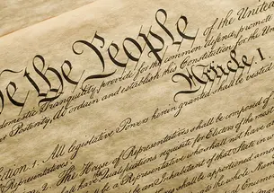 The top of the U.S. Constitution, starting with "We the People..."