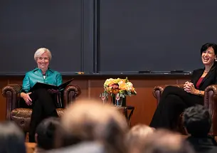 This is a photo of CDC director Rochelle Walensky speaking with Princeton President Emeritus Shirley M. Tilghman on the stage in McCosh 10.