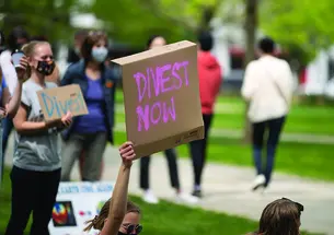 Protestors with Divest Signs