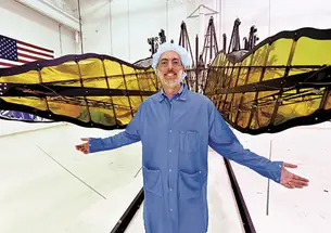 N. Jeremy Kasdin ’85 displays a prototype of starshade petals, built by interns from Princeton and MIT.