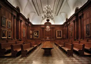 View of the interior of the Faculty Room in Nassau Hall. Below, portraits in the southeast corner of the room, including the large painting by Charles Willson Peale, “George Washington at the Battle of Princeton.”