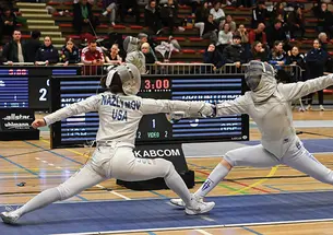 Two people fencing.