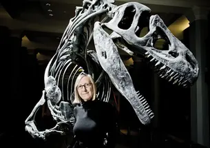 Gerta Keller in the atrium of Guyot Hall, with an Antrodemus dinosaur excavated during a 1941 dig.