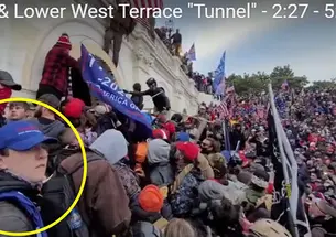 A yellow circle has been drawn about a boy in the foreground, wearing a blue baseball cap. In the background a crowd climbs over the wall around the Capitol.