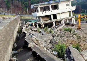 The ruined remains of a guesthouse and bayfront walkway in Kamaishi, Japan, 16 months after the March 2011 earthquake and ­tsunami that devastated the country’s northeastern coast.