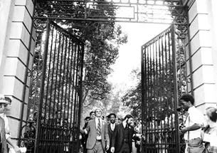  Class president Stewart Dill (now McBride), left, Hal Strelnick ’70, and Michael Calhoun ’70, behind, lead graduates through FitzRandolph Gate after their Commencement. Most ­seniors skipped the traditional Commence­ment gowns and wore armbands sym