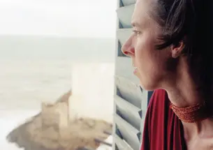 Katrina Browne ’89 at Cape Coast Castle, Ghana, in a room where slave-ship captains, including her ancestors, negotiated to purchase Africans.