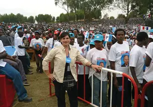 Kira Kay *03 on the ­campaign trail in Rwanda, where she was following President Paul Kagame, in August.