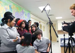 Geiseler with students at Cristo Rey High School in Harlem.