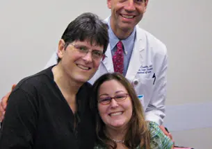 Bob Massie ’78, left, Dr. Stuart Knechtle ’78, and Jean Handler after the ­successful liver transplants.