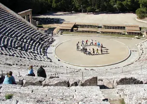 Students, singing “Old Nassau” at Epidaurus in Greece, traveled to the ancient theater to inspire their work on a Greek tragedy to be performed next fall in the Berlind Theatre.