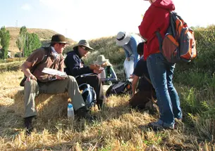 LIVE.Avkat_Students.jpg Graduate student Zack Chitwood, second from left, and his team discuss their latest finds.