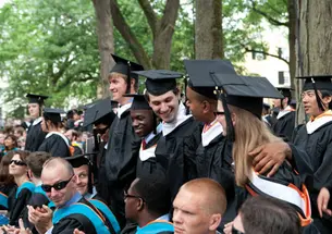  Standing, at center, as their degrees are awarded are, from left: Tina Zhen ’10, James Bryant ’10, Joseph Sengoba ’10, Josh Lavine ’10, David Clark ’10, and Alice Cassin ’10.