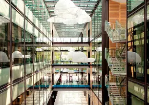 The focal point of the new chemistry building is the 75-foot-high atrium, called Taylor Commons. Research labs on the left are connected by 27-foot-long pedestrian bridges to offices on the right.