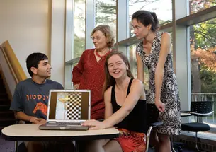 From left, graduate student Eugene Brevdo, math professor Ingrid Daubechies, and postdoc Shannon Hughes took part in a contest to identify which of six images of van Gogh paintings was a fake. Charlotte Caspers, far right, created the copy in the artistâ