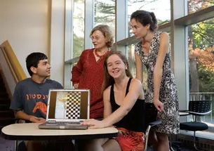 From left, graduate student Eugene Brevdo, math professor Ingrid Daubechies, and postdoc Shannon Hughes took part in a contest to identify which of six images of van Gogh paintings was a fake. Charlotte Caspers, far right, created the copy in the artistâ