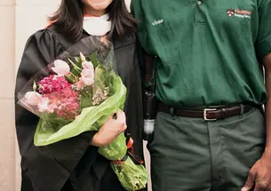 Josue Lajeunesse and Li Deng ’10 with flowers he gave her at Commencement.
