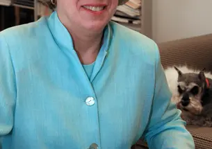 Nancy Weiss Malkiel, with Skipper behind her