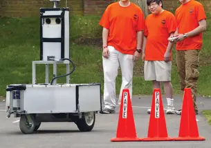 LIVE.NB_PAVE.jpg From left, Andrew Saxe ’08, Derrick Yu ’10, and Gordon Franken ’08 set up Kratos for a practice run in Princeton.