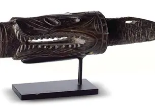 Part of a harpoon, carved from walrus ivory to suggest a predator of marine animals. The harpoon is believed to be from Alaska’s St. Lawrence Island.