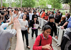  Freshmen receive high-fives as they are greeted in the Pre-rade following Opening Exercises.