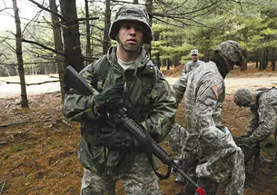 Peter Yorck ’10 with other ROTC cadets during field-training exercises March 28 at Fort Dix. At rear center is Lt. Col. John Stark, ROTC commander.