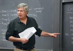 Visiting lecturer James Shinn ’73 *01 says his course is designed to offer “a reality of decision-making.”