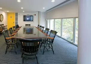 The James Madison Room in Whig Hall has energy-­efficient recessed lighting and a flat-screen television.