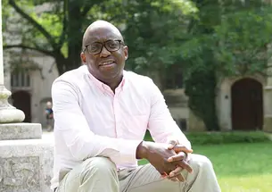 Jacob Dlamini sitting on steps on Princeton's campus.